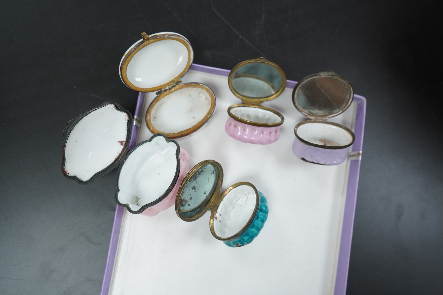 Five late 18th and 19th century enamel South Staffordshire patch boxes, largest 5.5cm wide